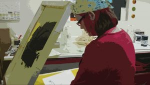 stylized photo of artist April Hoff making screenprints