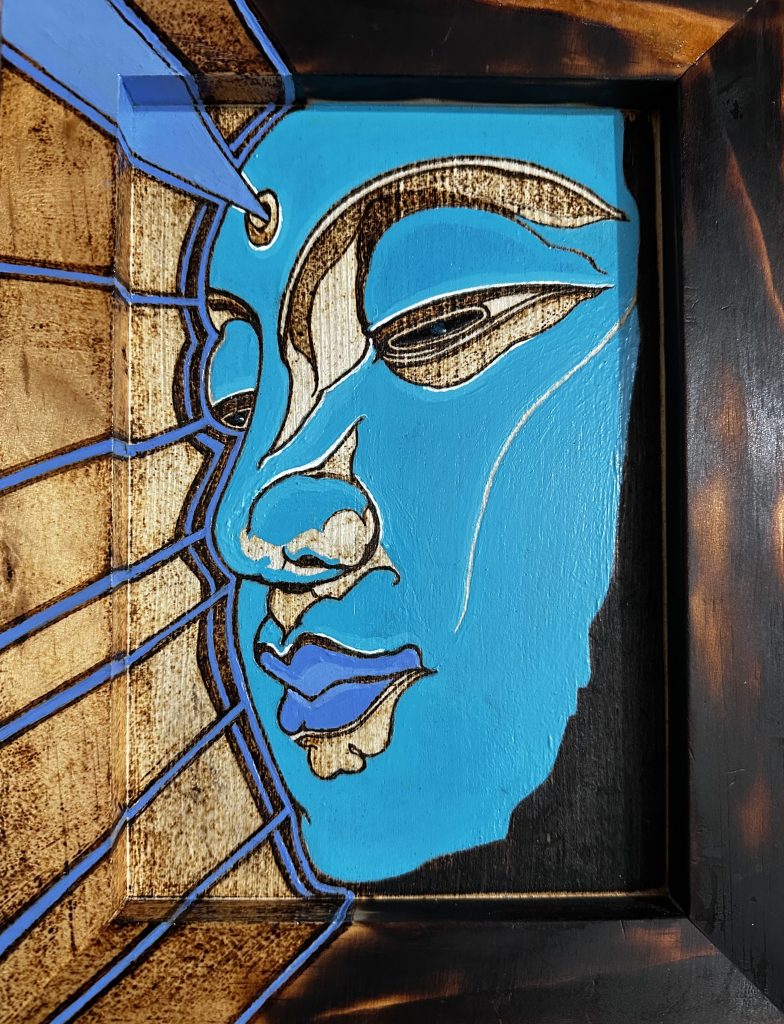 Pyrography, acrylic paint, and resin portrait on wood panel.